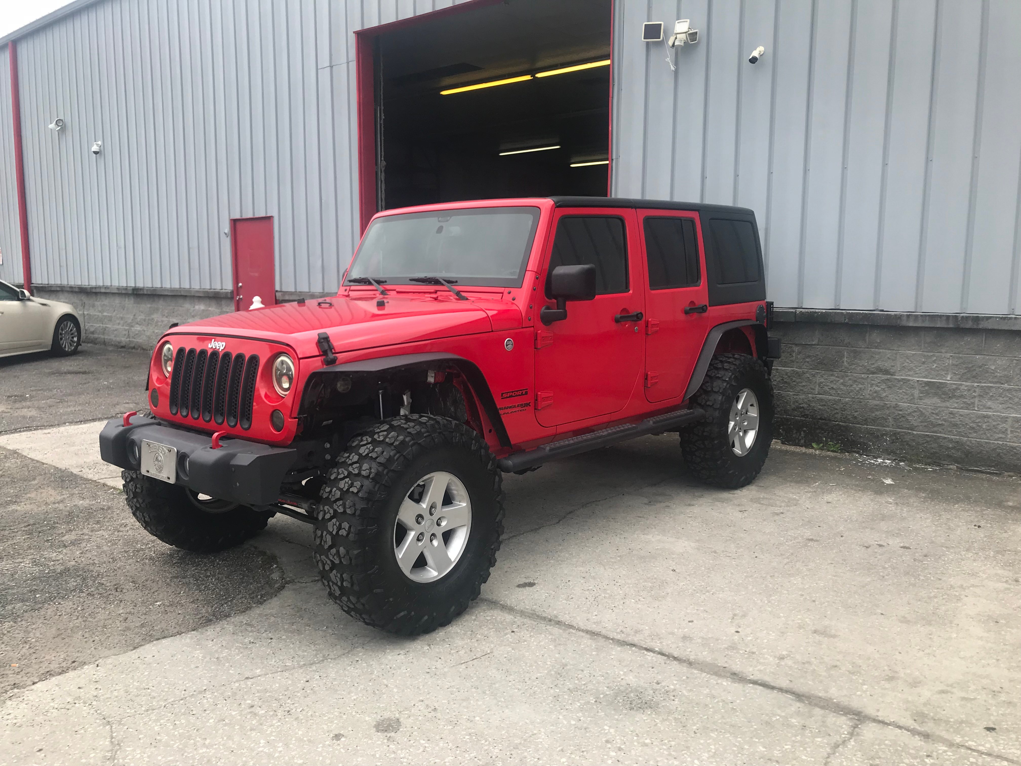 jeep wrangler 4 door lifted red